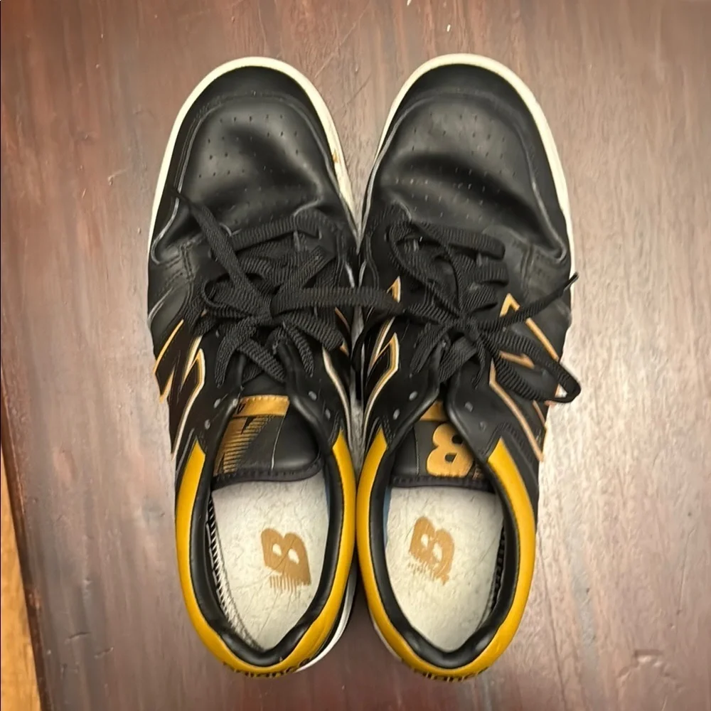 New Balance men’s black and gold/tan sneakers size 12